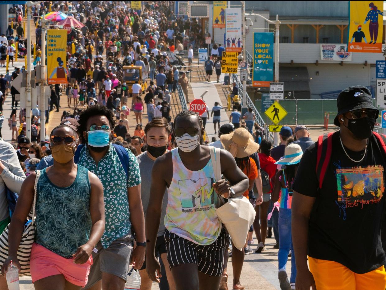 People wearing face masks in California (AP)