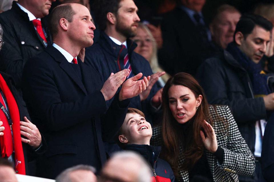 Britain's Prince William, Duke of Cambridge, (L), Britain's Prince George of Cambridge (C) and Britain's Catherine, Duchess of Cambridge, (R) attend the Six Nations international rugby union match between England and Wales at Twickenham Stadium, west London, on February 26, 2022.