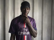 Abdul Kerim, 20, from Togo, poses for a portrait aboard the humanitarian rescue ship Ocean Viking, in Italian waters off the Sicilian town of Messina, southern Italy, Monday, Sept. 23, 2019, hours before disembarking. Kerim fled his country because he was persecuted for protesting against the government. He wants to reunite with brothers and aunts living in Germany and hopes to be granted asylum although he left a wife and a two-year-old son in Togo. He is open to any kind of work, though he dreams of having his own construction company. It wasn’t Abdul Kerim’s first attempt at crossing the Mediterranean, he was intercepted by the Libyan Coast Guard on his first try and sent to a detention center where there was no clean water to drink. (AP Photo/Renata Brito)