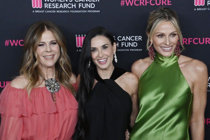 Rita Wilson, Demi Moore and Jamie Tisch, from left to right, attend the "An Unforgettable Evening" gala benefiting the Women's Cancer Research Fund on Wednesday. Photo by Jim Ruymen/UPI