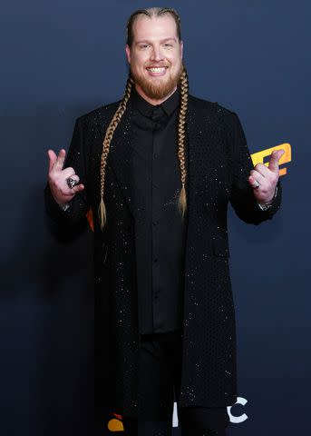 <p>Tyler Golden/NBC via Getty</p> Huntley posing backstage after his win in 'The Voice' finale.