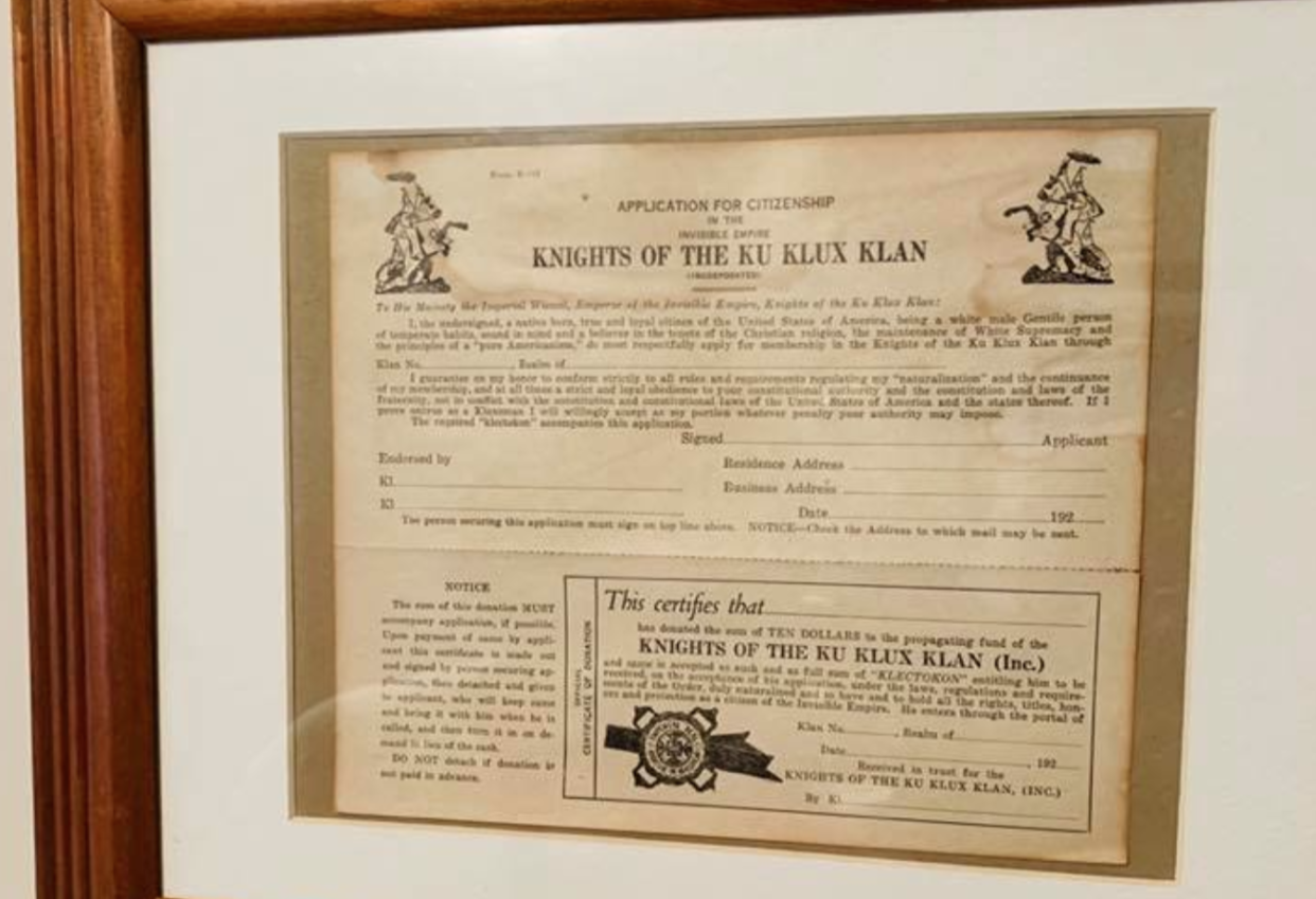 Rob Mathis shared a photo of a framed KKK application that he found inside a home for sale by a Muskegon Police Officer on social media. (Photo: Facebook)