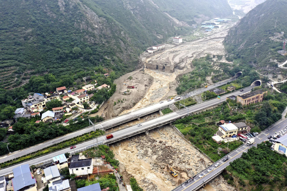 In this aerial photo released by China's Xinhua News Agency, a landslide site is seen in Miansi Township of Wenchuan County in southwestern China's Sichuan Province, Tuesday, June 27, 2023. Several people were found dead and others remained missing after landslides hit a county in China's southwestern Sichuan province on Tuesday, leading to authorities evacuating more than 900 people. (Xinhua via AP)