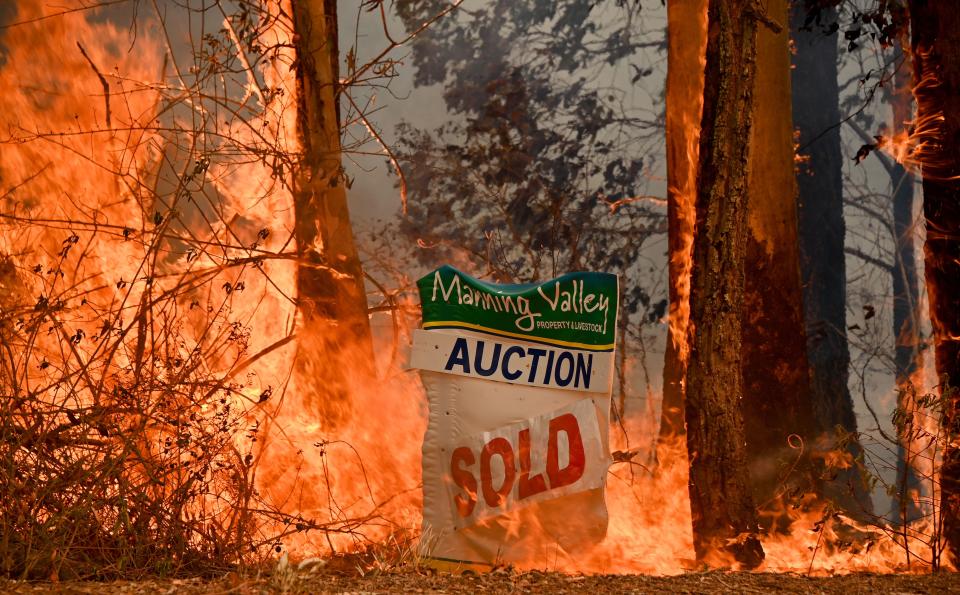 A bushfire burns outside a property near Taree, 350km north of Sydney on November 12, 2019. - A state of emergency was declared on November 11, 2019 and residents in the Sydney area were warned of "catastrophic" fire danger as Australia prepared for a fresh wave of deadly bushfires that have ravaged the drought-stricken east of the country. (Photo by PETER PARKS / AFP) (Photo by PETER PARKS/AFP via Getty Images)