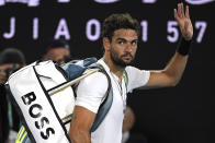 Matteo Berrettini of Italy waves as he leaves Rod Laver Arena after losing his semifinal to Rafael Nadal of Spain at the Australian Open tennis championships in Melbourne, Australia, Friday, Jan. 28, 2022.(AP Photo/Andy Brownbill)