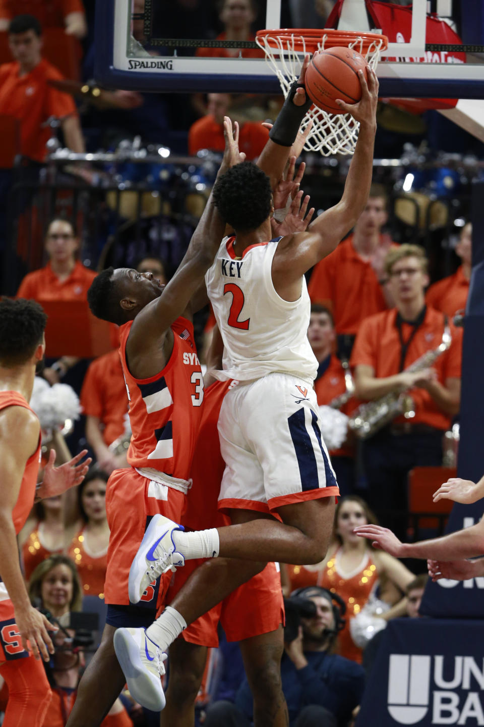 Virginia guard Braxton Key (2) puts up a shot in front of Syracuse forward Bourama Sidibe (34) during the first half of an NCAA college basketball game in Charlottesville, Va., Saturday, Jan. 11, 2020. (AP Photo/Steve Helber)