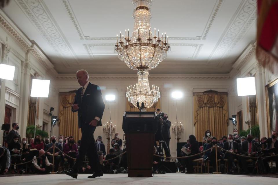 Joe Biden departs after the conference.