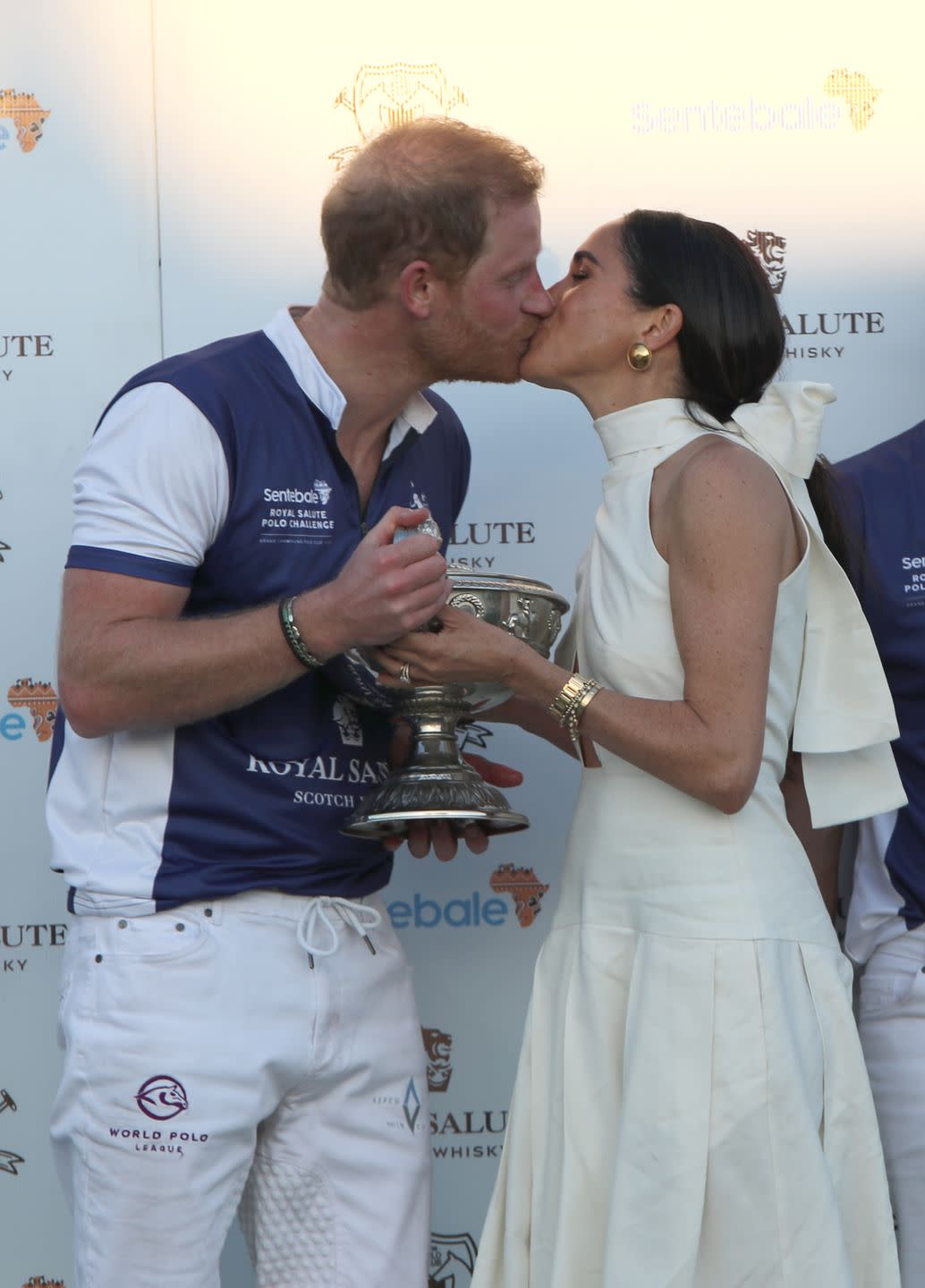 the duchess of sussex presents the trophy to her husband, the duke of sussex after his team the royal salute sentebale team defeated the grand champions team, in the royal salute polo challenge, to benefit sentebale, at the uspa national polo center in wellington, florida, us picture date friday april 12, 2024 photo by yaroslav sabitovpa images via getty images