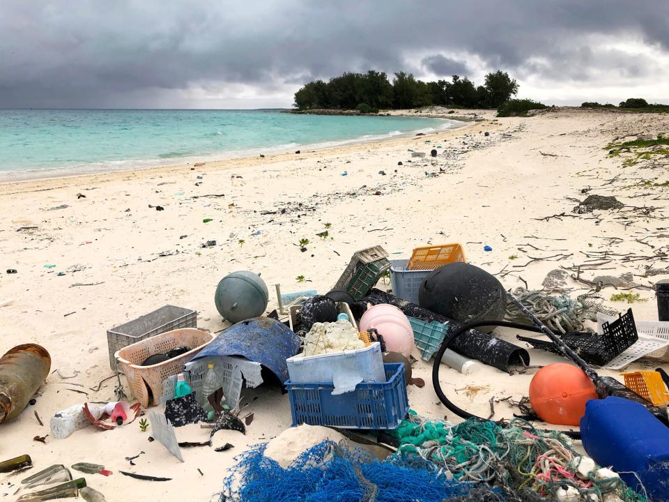 Plastic, fishing nets and other debris washed up on the beach on Midway Atoll in the Northwestern Hawaiian Islands on Oct. 22, 2019. America needs to rethink and reduce the way it generates plastics because so much of it is littering the oceans, the National Academy of Sciences recommends in a new report on Dec. 1, 2021.