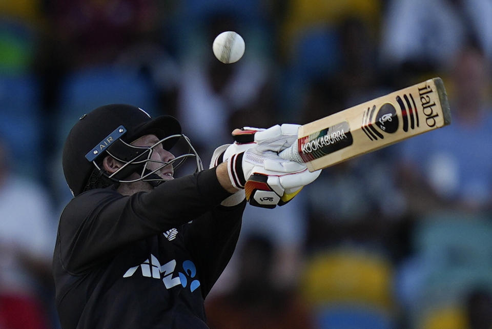 New Zealand's Lockie Ferguson plays a shot against West Indies during the first ODI at Kensington Oval in Bridgetown, Barbados, Wednesday, Aug. 17, 2022. (AP Photo/Ramon Espinosa)