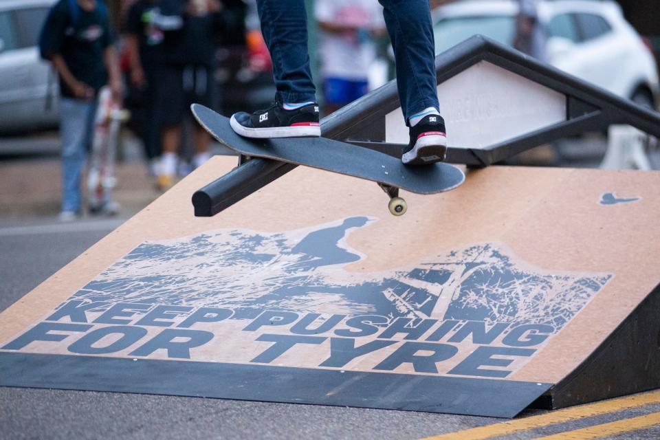 A skateboarder grinds on a rail above a ramp that says “keep it pushing for Tyre” during the celebration for what would have been Nichols’ 30th birthday at Fourth Bluff Park in Downtown Memphis on Monday, June 5, 2023. 