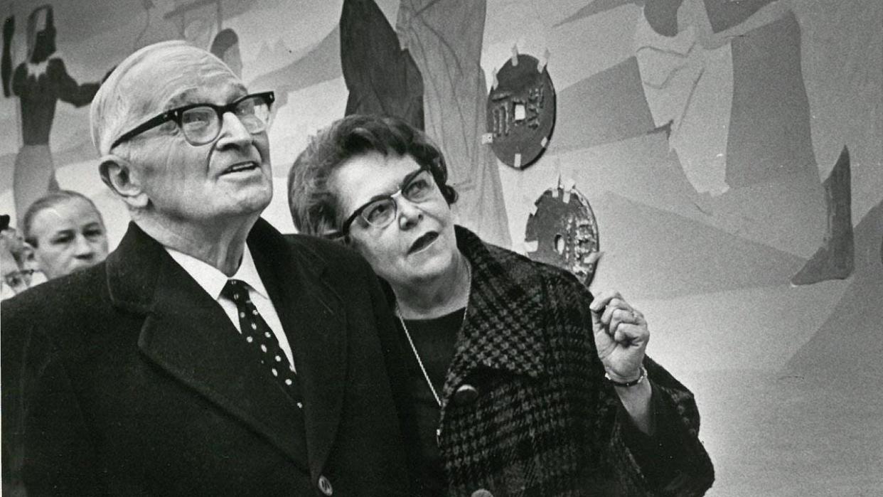 Former President Harry S. Truman tours the new Capital City State Bank on the arm of U.S. Treasurer Georgia Neese Gray.