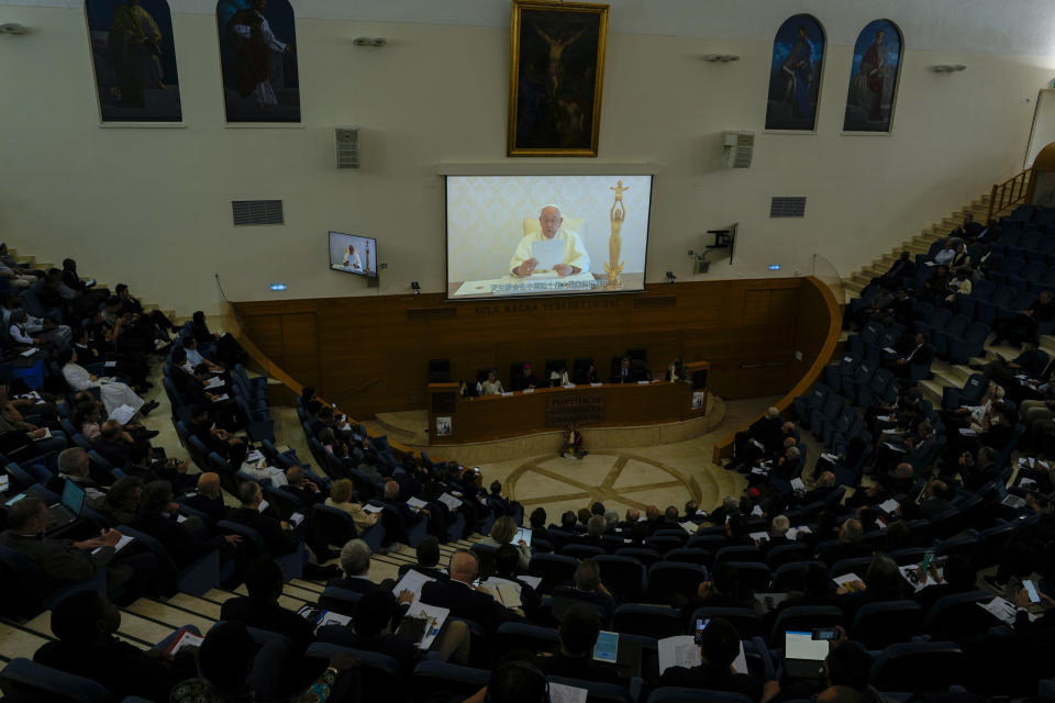 Pope Francis, seen on giant screen, delivers his address at the international conference to celebrate "100 years since the Concilium Sinense: between history and the present" celebrating the First Council of the Catholic Church in China, organized by the Pontifical Urbaniana University, in Rome, Tuesday, May 21, 2024. (AP Photo/Andrew Medichini)