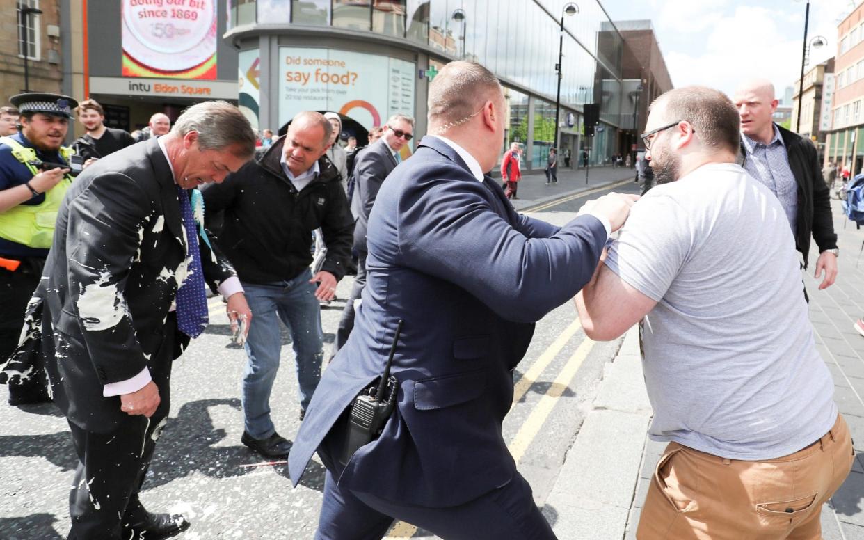 Milkshake being thrown on Nigel Farage - REUTERS