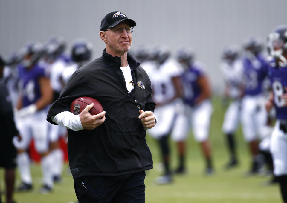 FILE - Baltimore Ravens special teams coordinator and associate head coach Jerry Rosburg walks on the field during NFL football training camp in Owings Mills, Md., July 29, 2017. Several years after giving up his dream of ever becoming a head coach, Rosburg was asked to lead the Denver Broncos over the final two weeks of the season following Nathaniel Hackett's dismissal. (AP Photo/Patrick Semansky, File)