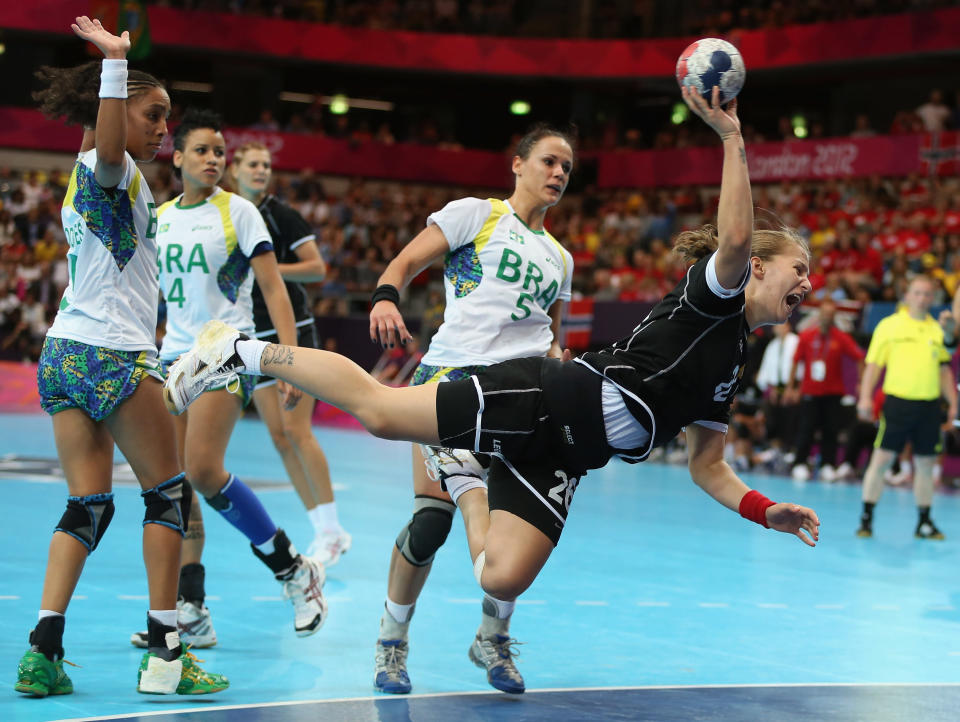 LONDON, ENGLAND - JULY 30: Suzana Lazovic of Montenegro shoots and scores during the Women's Handball Preliminaries Group A - Match 11 between Brazil and Montenegro on Day 3 of the London 2012 Olympic Games at the Copper Box on July 30, 2012 in London, England. (Photo by Jeff Gross/Getty Images)