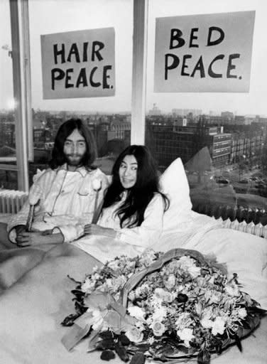 File picture. Beatles member John Lennon (L) and his wife Yoko Ono receive journalists on 25 March 1969 in the bedroom of the Hilton hotel in Amsterdam, during their honeymoon in Europe