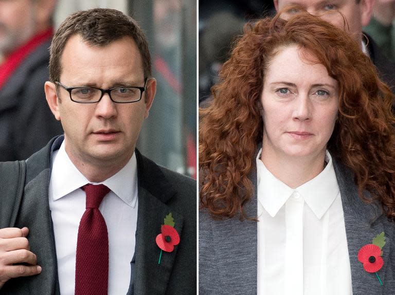 A combination of pictures created on October 31, 2013 shows former News of the World editor and Downing Street communications chief Andy Coulson (L) and Rebekah Brooks (R), former News International chief executive