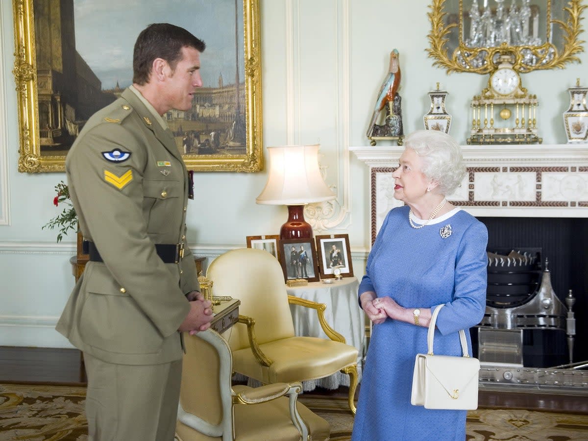 Ben Roberts-Smith meets the late Queen Elizabeth II at Buckingham Palace in 2011 (Anthony Devlin/PA Archive/PA Images)