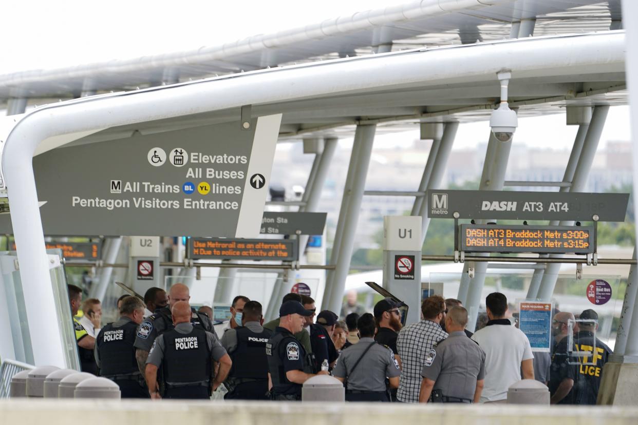 Police are seen at the Pentagon Metro area, Tuesday, Aug. 3, 2021 at the Pentagon in Washington. Gunshots were fired Tuesday morning near the entrance of the Pentagon, resulting in multiple injuries. The facility, the headquarters of the U.S. military, was placed on lockdown. The Arlington County Fire Department reported "multiple patients," but it wasn't immediately clear if they had been shot or the extent of the injuries.