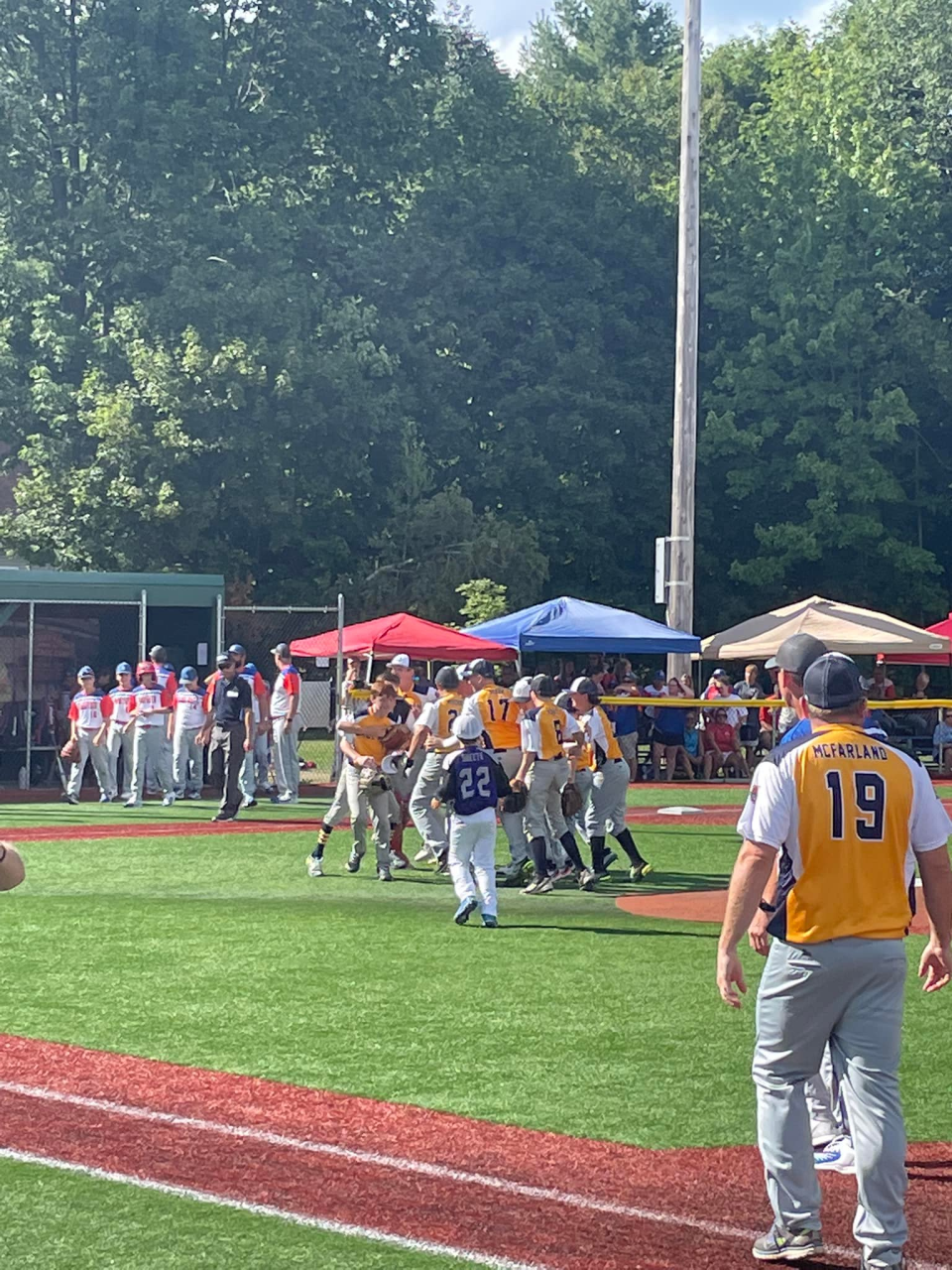 Members of the Weymouth team celebrate at the Cal Ripken 12U World Series in Waterville, Maine.