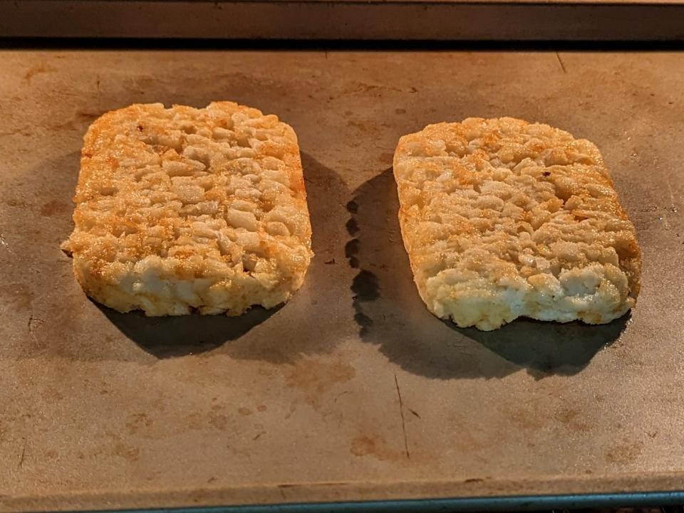 two cooked hash brown on a sheet pan in an oven