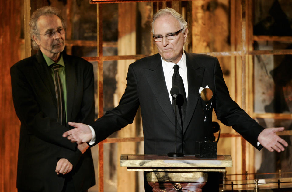 FILE - Jerry Moss, right, and Herb Alpert, co-founders of A&M Records, appear during their induction into the Rock & Roll Hall of Fame in New York on March 13, 2006. Moss, a music industry giant who co-founded A&M Records, died Wednesday at his home in Bel Air, Calif. He was 88. (AP Photo/Jeff Christensen, File)