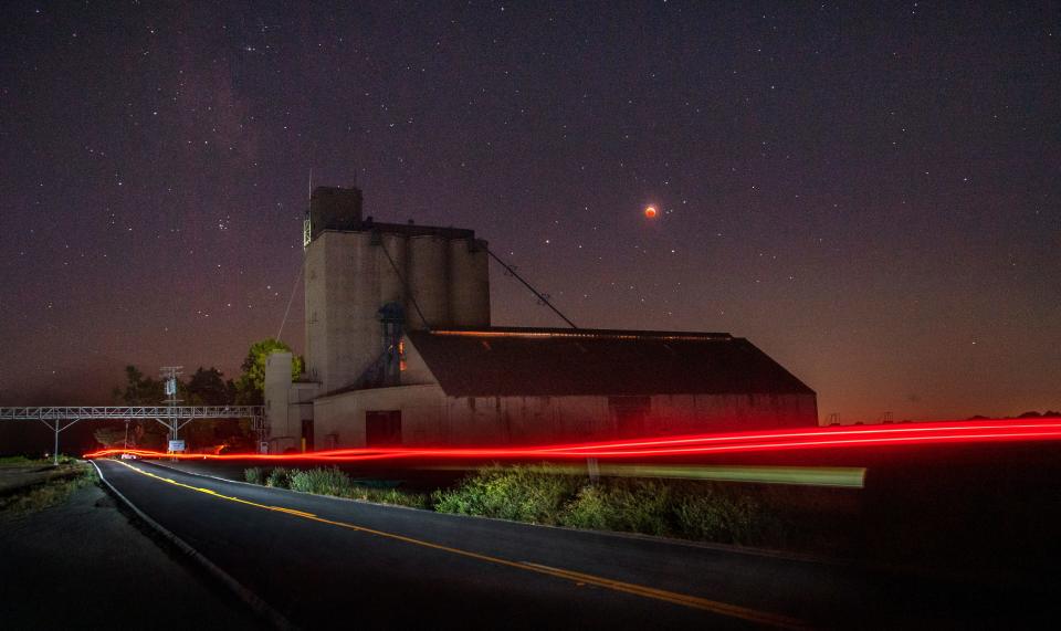 (5/26/21) A rare supermoon eclipse is seen near a grain silo on Staten Island Road near Walnut Grove in the Delta. Also known as a blood moon for the color it often turns during total eclipse, the supermoon is when a full moon is closer than usual in it's elliptical orbit making it appear slightly larger. Also May's full moon is also called a "Flower Moon" by the Old Farmer's Almanac referring to flowers that bloom in May. CLIFFORD OTO/THE STOCKTON RECORD