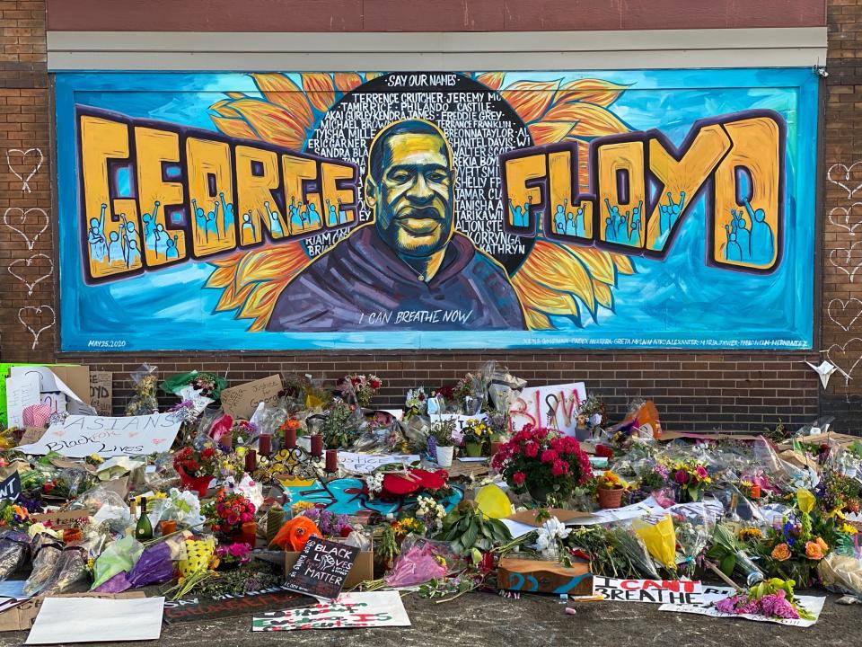 A makeshift memorial for George Floyd including a mural, cards and flowers on June 1, 2020 is seen near the spot where he died while in police custody in Minneapolis, Minn. 