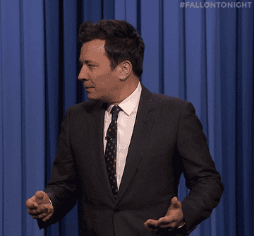 A GIF of Jimmy Fallon looking confused and saying "what?"