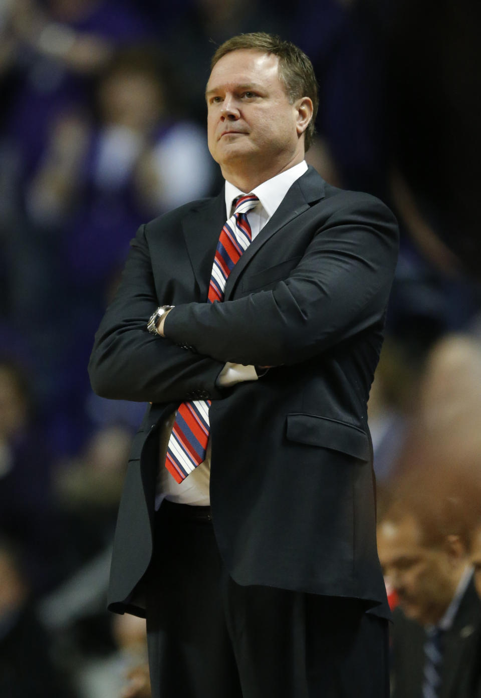 Kansas head coach Bill Self watches his team during the first half of an NCAA college basketball game against Kansas State in Manhattan, Kan., Monday, Feb. 10, 2014. (AP Photo/Orlin Wagner)