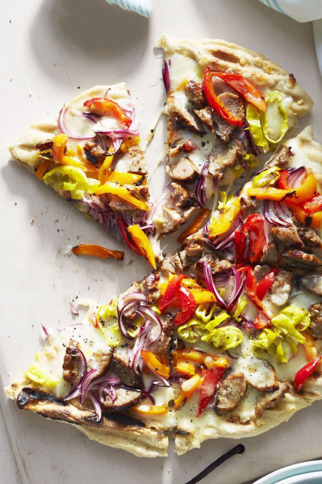 <p>Fire up the oven or the grill for this action-packed pizza that's <em>way</em> better than delivery. </p><p>Get the <a href="https://www.goodhousekeeping.com/food-recipes/easy/a45190/bbq-italian-sausage-pepper-pie-recipe/" rel="nofollow noopener" target="_blank" data-ylk="slk:BBQ Italian Sausage and Pepper Pie recipe;elm:context_link;itc:0;sec:content-canvas" class="link "><strong>BBQ Italian Sausage and Pepper Pie recipe</strong></a>.</p>