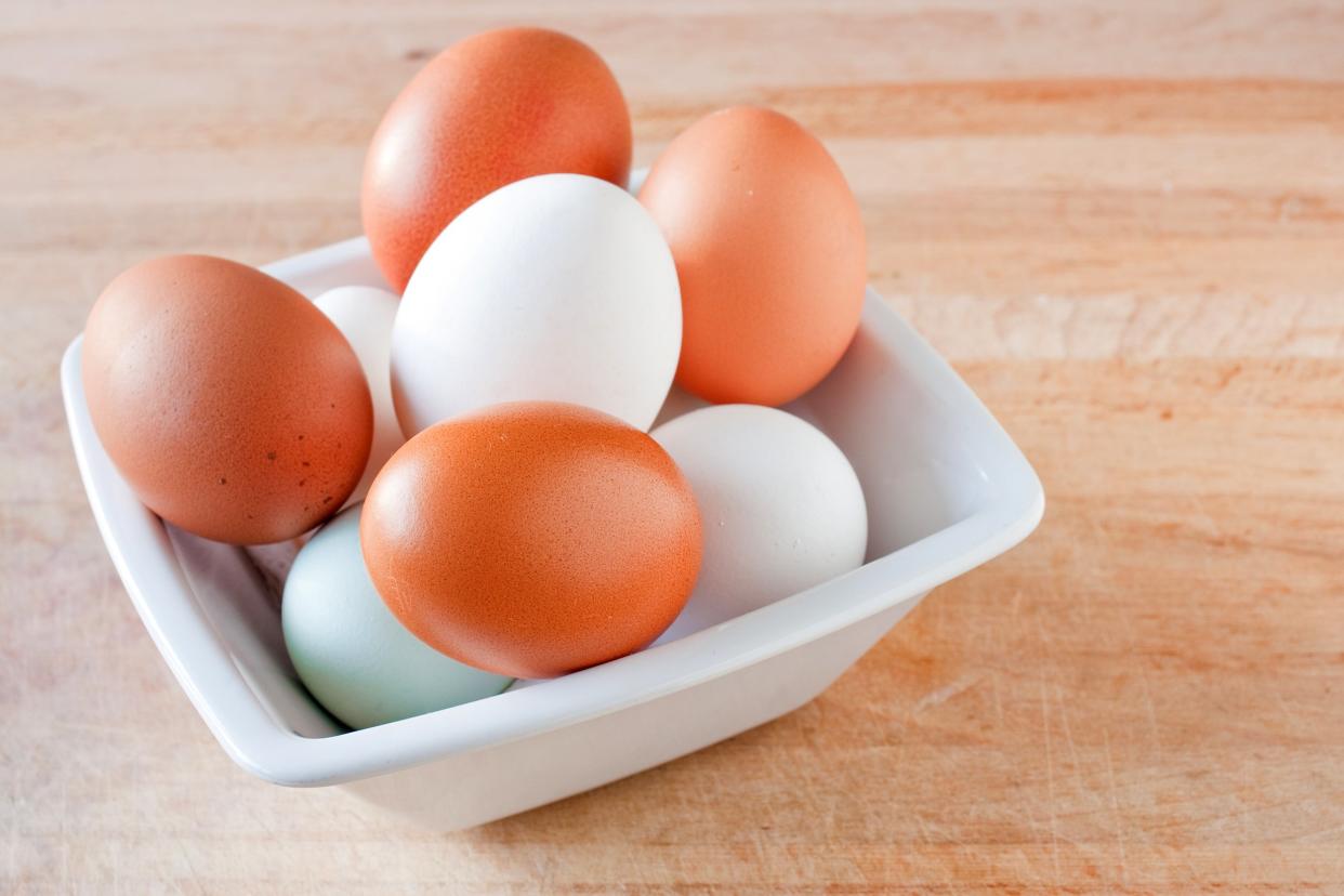 Bowl of white and brown eggs