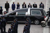 A hearse carrying the casket of slain U.S. Capitol Police officer William “Billy” Evans arrives at the Capitol, Tuesday, April 13, 2021 in Washington. (Carlos Barria/Pool via AP)