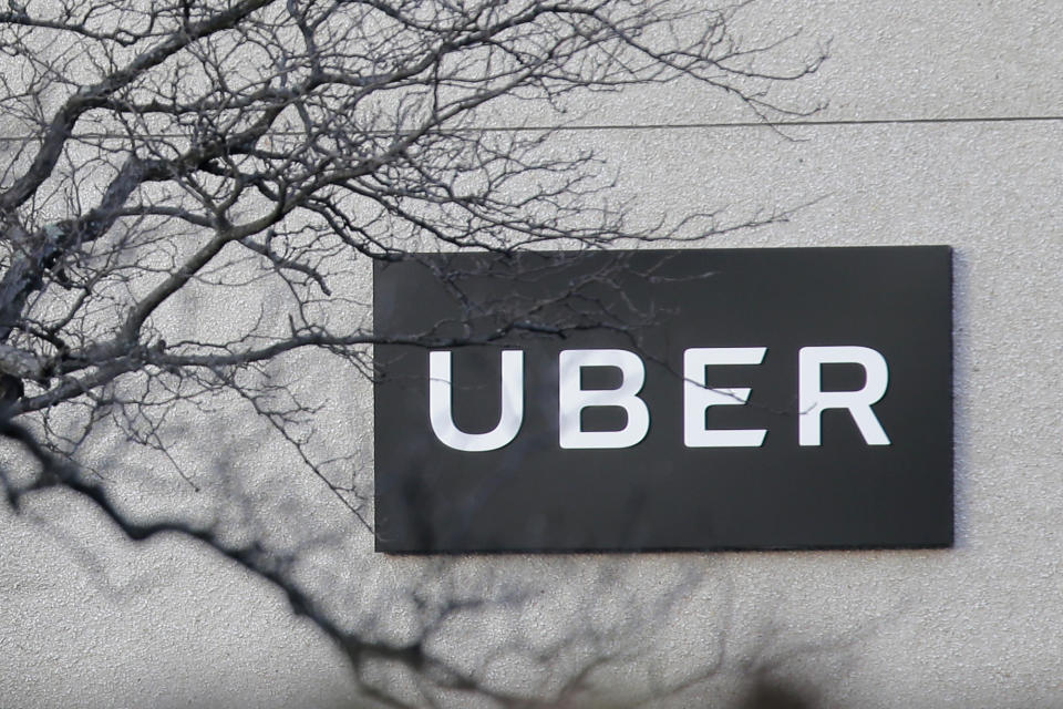 FILE - In this Nov. 15, 2019, file photo is an Uber office in Secaucus, New Jersey, USA. Uber is giving its U.K. drivers the minimum wage, pensions and holiday pay, following a recent court ruling that said they should be classified as workers and entitled to such benefits, the company announced Tuesday, March 16, 2021. (AP Photo/Seth Wenig, File)