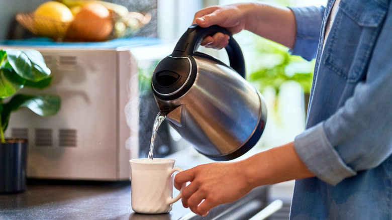 water pouring in mug