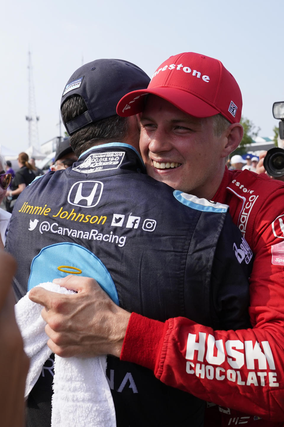 Marcus Ericsson, of Sweden, celebrates with Jimmie Johnson after winning the first race of the IndyCar Detroit Grand Prix auto racing doubleheader on Belle Isle in Detroit, Saturday, June 12, 2021. (AP Photo/Paul Sancya)