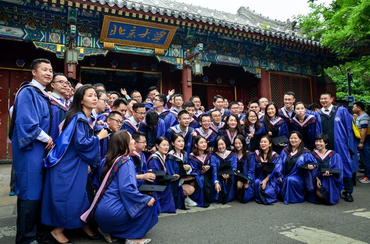 <span class="caption">Graduates from Peking University, China.</span> <span class="attribution"><a class="link " href="https://www.shutterstock.com/image-photo/peking-universitybeijingchinajuly-22016graduates-take-graduation-photos-447640342" rel="nofollow noopener" target="_blank" data-ylk="slk:tangxn/Shutterstock;elm:context_link;itc:0;sec:content-canvas">tangxn/Shutterstock</a></span>