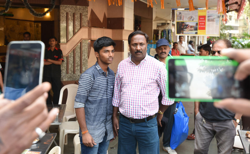 MUMBAI, INDIA - JANUARY 6: Mumbai school cricketer Pranav Dhanawade with his coach Mobin Sheikh at restaurant at Mantunga on January 6, 2016 in Mumbai, India. Mumbai school cricketer Pranav Dhanawade scored a world record of 1,009 not out in an HT Bhandari Cup Under-16 inter-school tournament match. Mumbai Cricket Association (MCA) announced a scholarship of Rs.10,000 per month for the 15-year-old. (Photo by Kunal Patil/Hindustan Times via Getty Images)