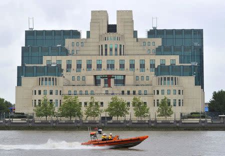 A motorboat passes by the MI6 building in London August 25, 2010. REUTERS/Toby Melville/File Photo