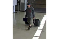 This airport surveillance camera image released in an FBI affidavit shows alleged suspect Marc Muffley at Lehigh Valley International Airport in Allenstown, Pa., on Monday, Feb. 27, 2023. Muffley was arrested Monday after an explosive was found in a bag checked onto a Florida-bound flight, federal authorities said. (FBI via AP)