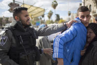 <p>An Israeli border police officer pushes away Palestinian protesters outside the Damascus Gate in Jerusalem’s Old City, Thursday, Dec. 7, 2017. (Photo: Ariel Schalit/AP) </p>