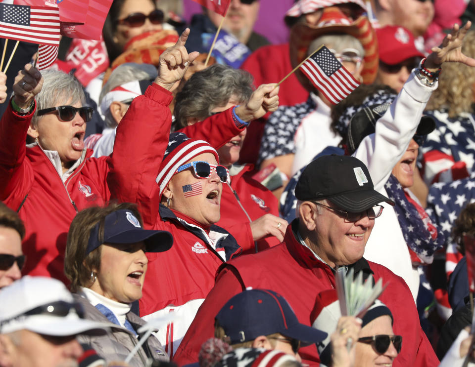 Golf fans cheers on their teams in the Solheim cup at Gleneagles, Auchterarder, Scotland, Friday, Sept. 13, 2019. (AP Photo/Peter Morrison)
