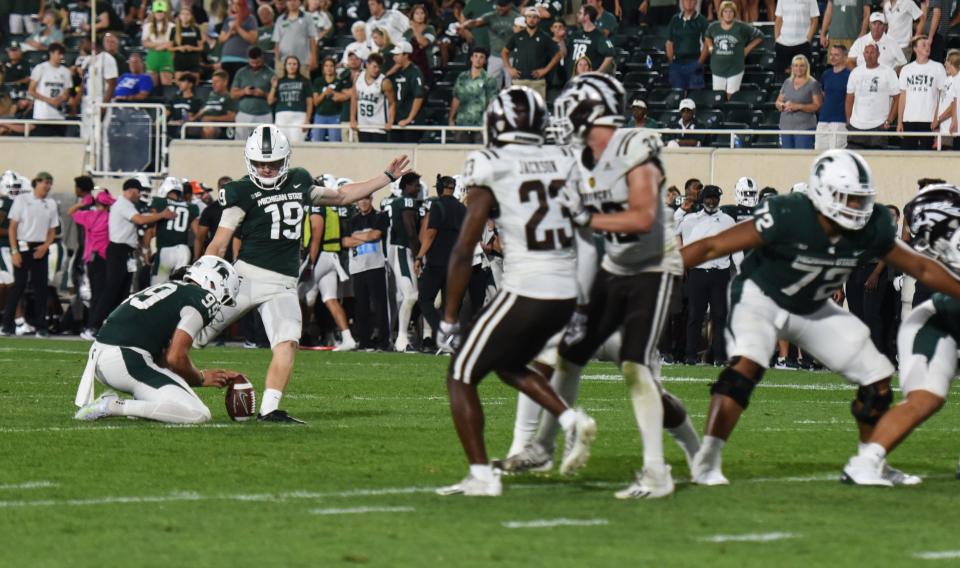 MSU kicker Jack Stone attempts a field goal as Bryce Baringer holds the ball Friday. Sept. 2, 2022,during the season opener against Western Michigan University at Spartan Stadium. MSU won 35-13.