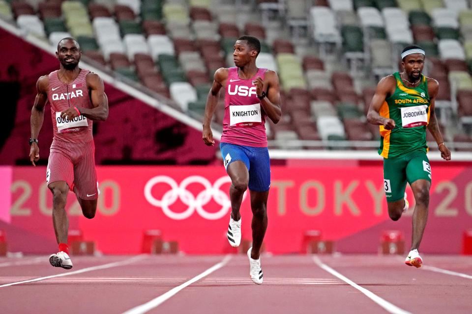 American Erriyon Knighton runs in the 200 meters at the Tokyo Olympics.