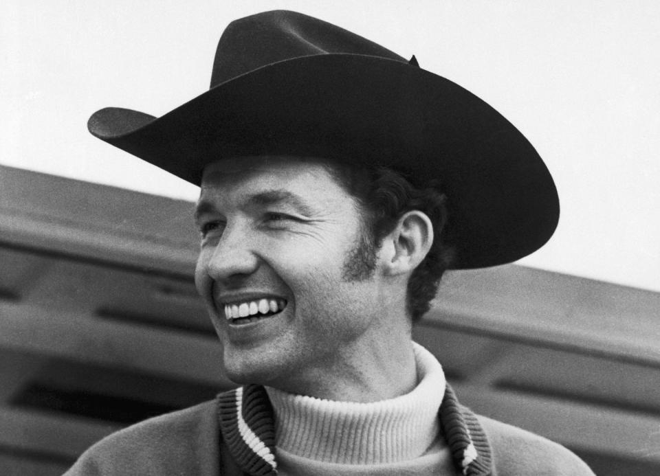 racecar driver richard petty wearing black cowboy hat