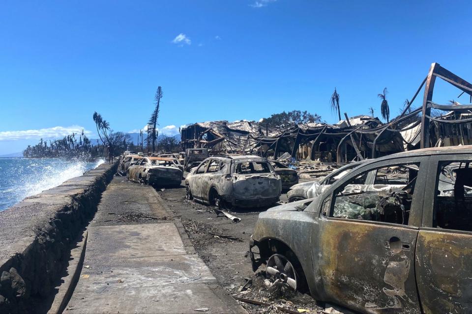 PHOTO: Burned cars and destroyed buildings are pictured in the aftermath of a wildfire in Lahaina, western Maui, Hawaii on August 11, 2023. A wildfire that left Lahaina in charred ruins has become one of deadliest disasters in the U.S. state's history. (Paula Ramon/AFP via Getty Images)