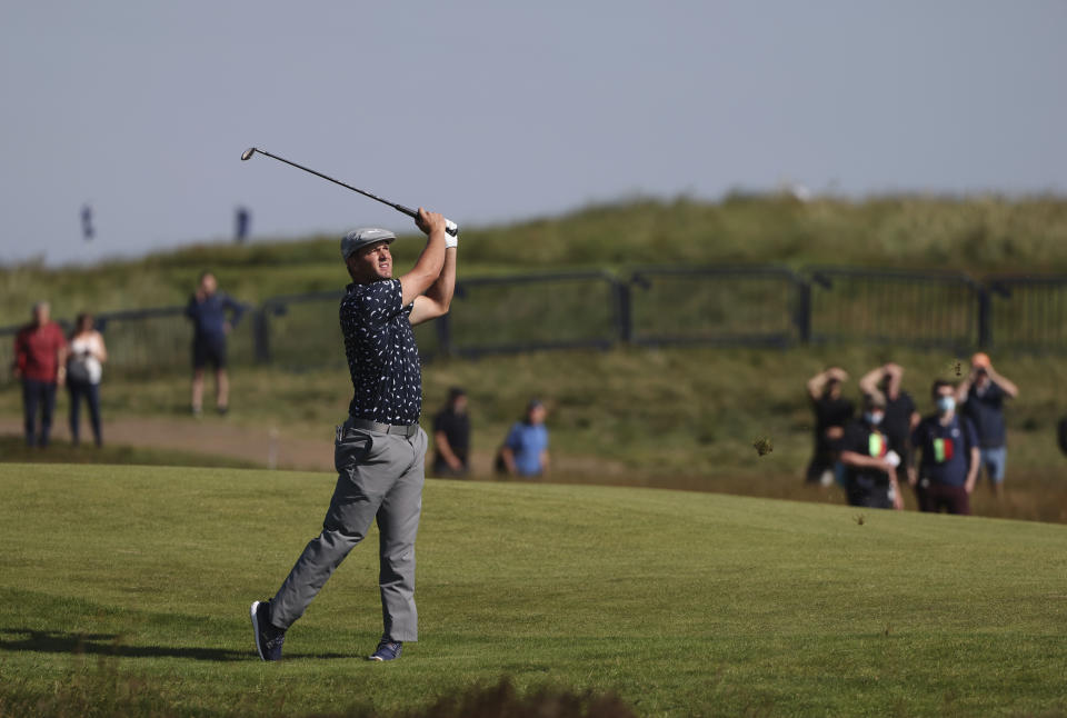 United States' Bryson DeChambeau plays a shot from the 1st fairway during the first round British Open Golf Championship at Royal St George's golf course Sandwich, England, Thursday, July 15, 2021. (AP Photo/Ian Walton)