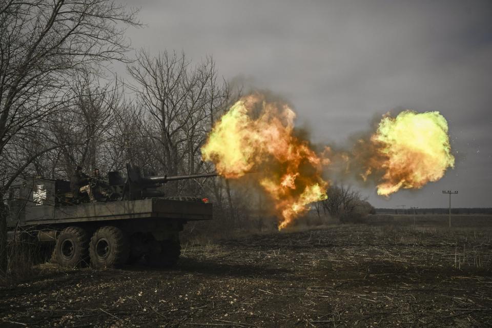 Ukrainian servicemen fire with a S60 anti-aircraft gun at Russian positions near Bakhmut (AFP/Getty)