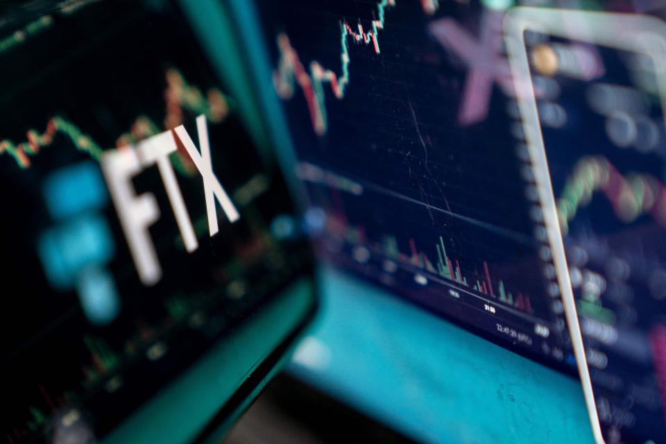 This photo illustration shows the logo of cryptocurrency FTX, reflected in its website on a laptop screen in Washington, DC, on November 13, 2022.